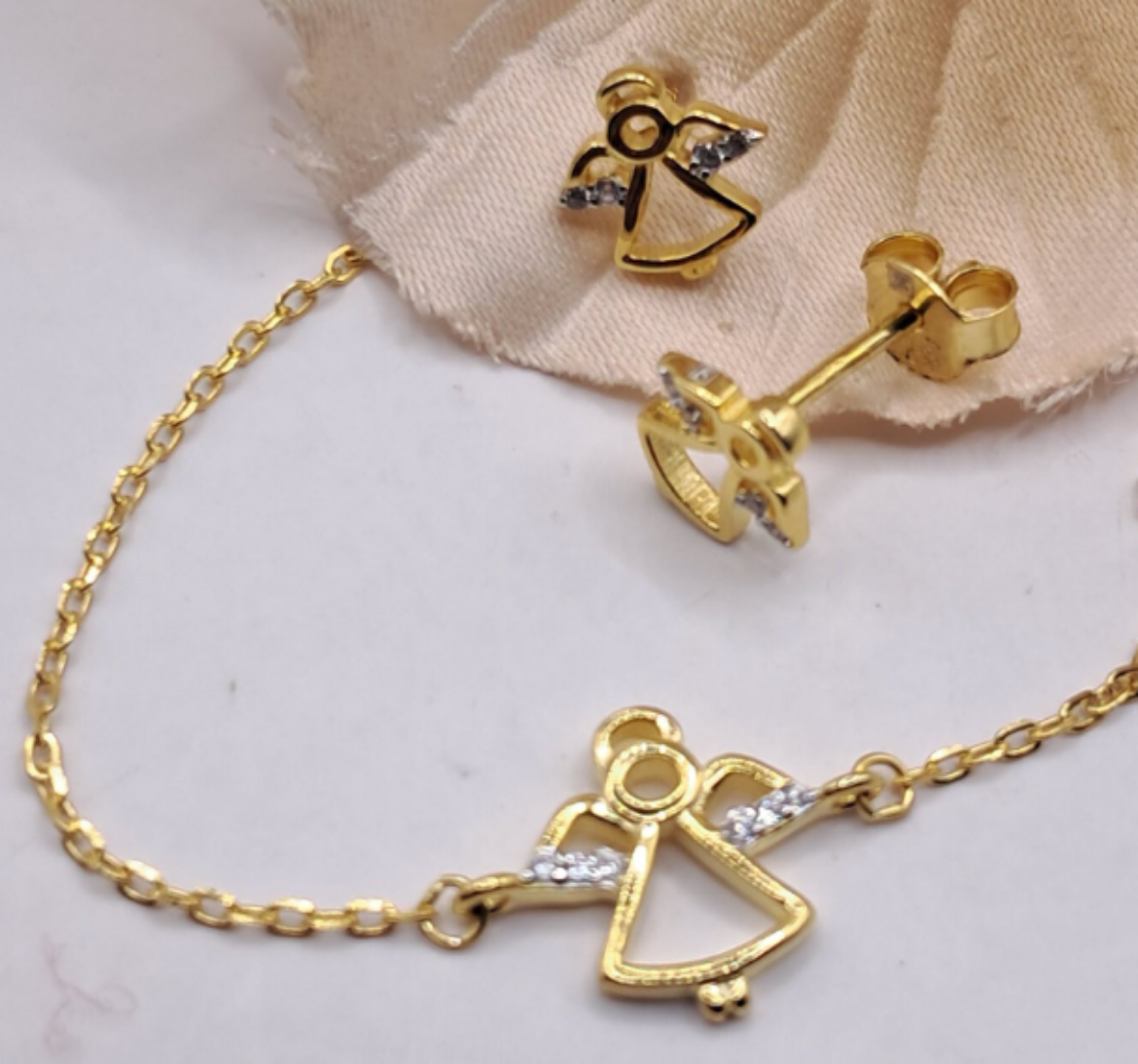 Imagem de Conjunto em Prata dourada com Zirconias pulseira + Brincos 